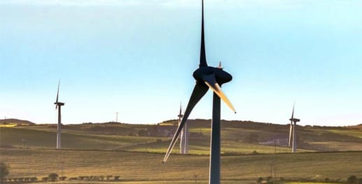 Wind turbines spinning in green fields