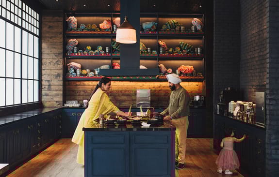 Family preparing a meal in modern kitchen