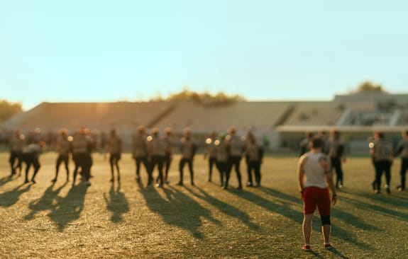 Young men playing rugby