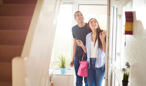 Couple entering home