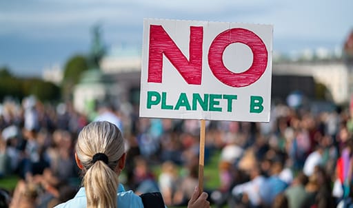 Protestor with sign saying No Planet B