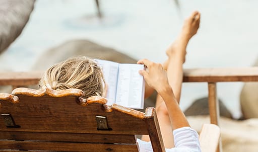 Young woman reading a book while relaxing