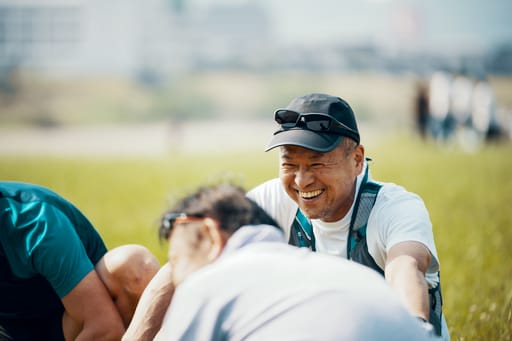 Man smilinh at sporting event