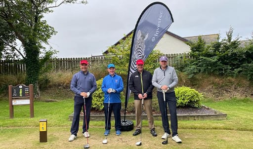 The Children’s Centre annual golf competition with Investec flag behind players ready to tee off