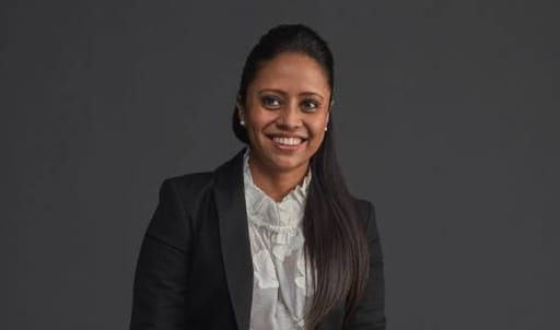 A photo of Pooja Naidoo, an Investec private banker to international clients, who's worked at Investec since 2002