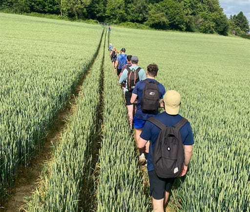 team walking through a field