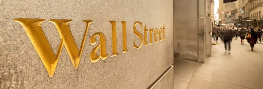 Wall Street sign on the wall of a building