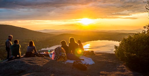 Family picnic overlooking lake