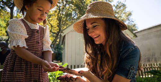 Mother and daughter working in the garden