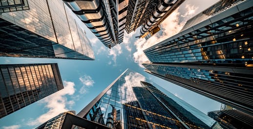 looking upwards at modern city buildings in London