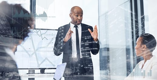 Businessman delivering a presentation to his colleagues in the boardroom