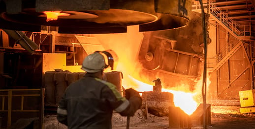 Metals being shaped in fire furnace