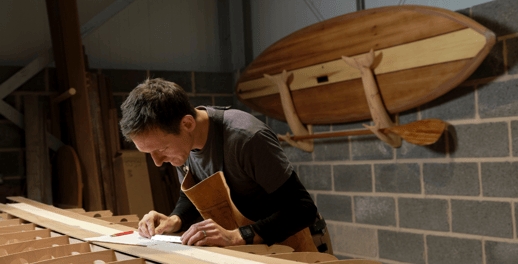 man hand crafting wood