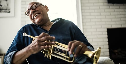 Smiling old man with his trumpet