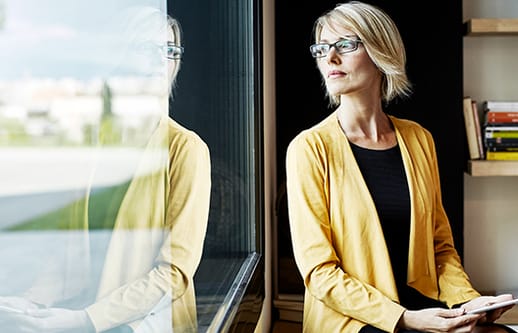 blonde lady staring out the window