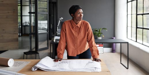 Female checking building plans