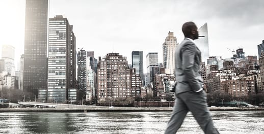 Corporate finance: businessman walking in city