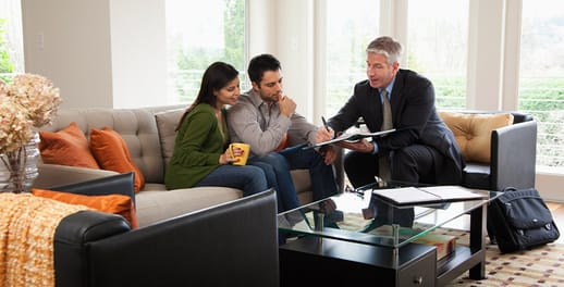 Financial adviser chatting with a couple