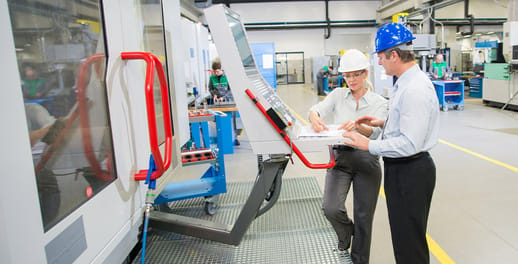 two people checking product on factory floor