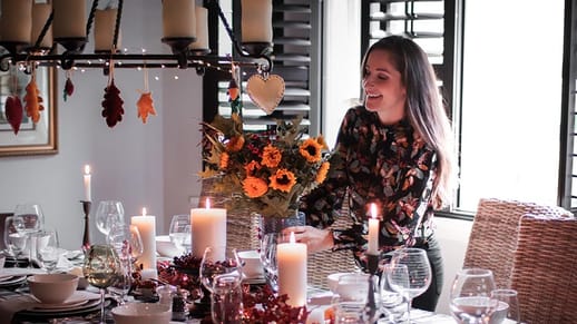 A woman setting her dining table