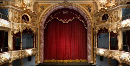 The Everyman Theatre, with the curtain lowered across the stage