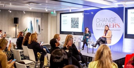 A room full of people listen to speakers at the Changemakhers event at Investec, run in partnership with The Women's Chapter