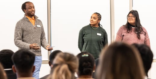 Young person being taught how to present