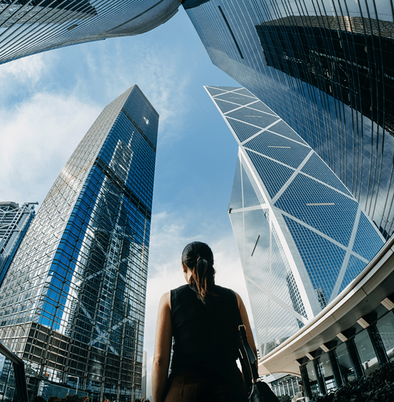 Woman looking at business buildings