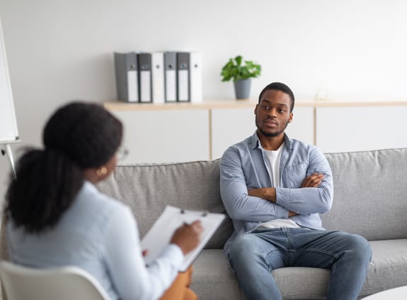 Mental health: man in therapy session