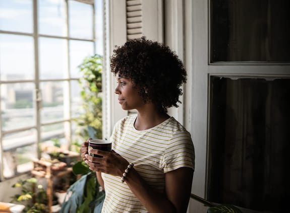woman looking out the window