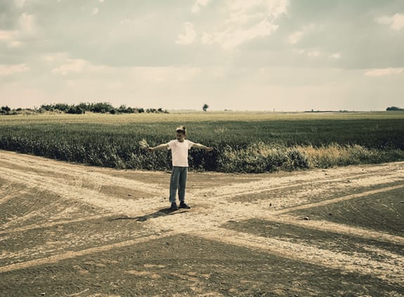 Savings: boy at crossroads