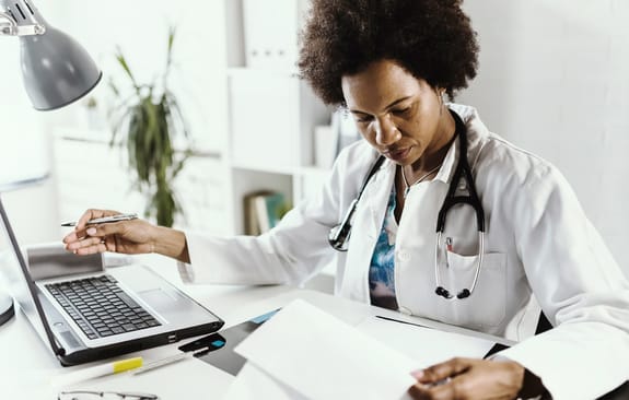 Doctor working on laptop
