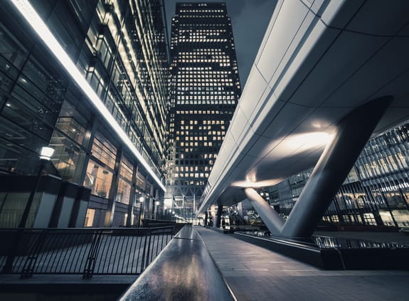 Looking towards a modern office building with walkway at night