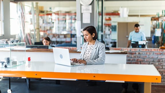 business owner working on a laptop