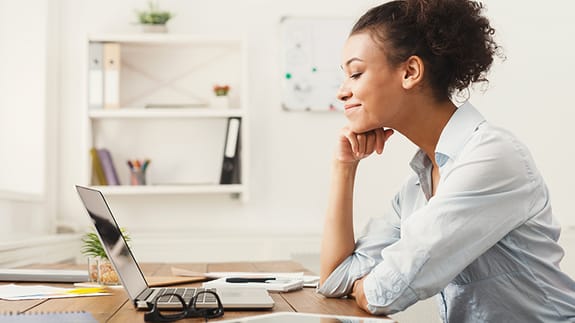 Woman browsing on a laptop