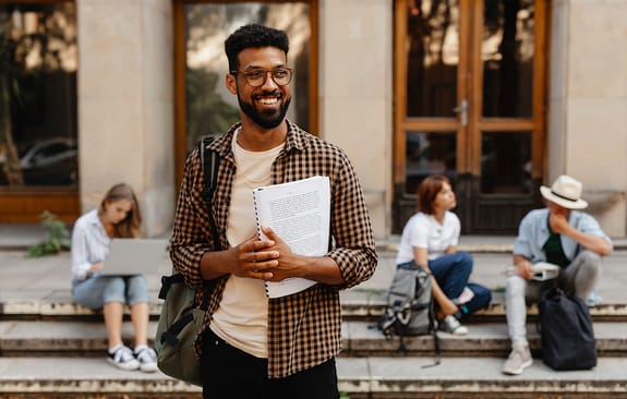 Young professional standing outside a building