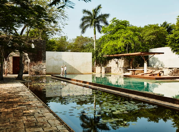 View across pool and fish pond of exotic location
