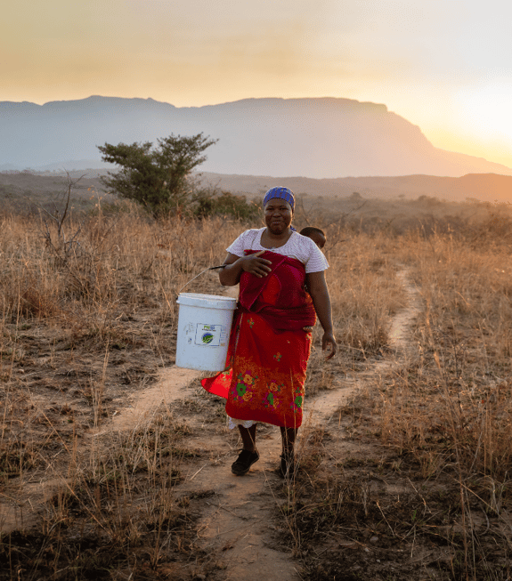woman carrying a bucket of water