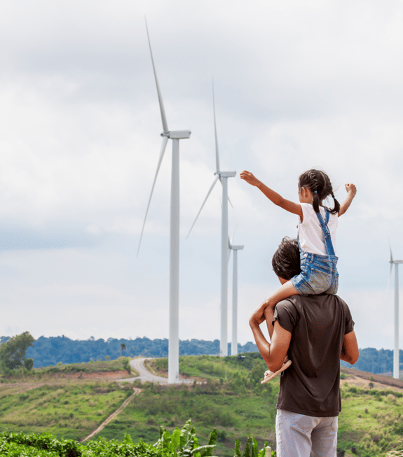 father and daughter on a windmill farm