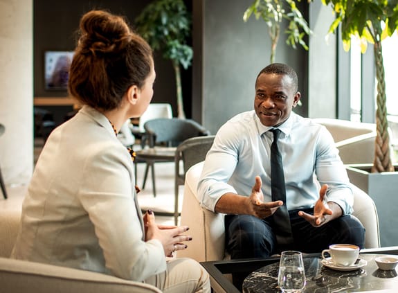 consultants talking in a coffee space