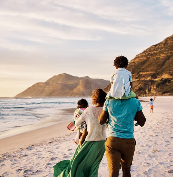 Family walking along beach