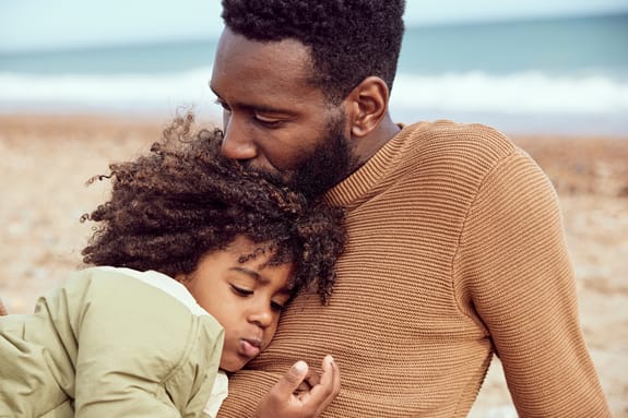 Father and son sharing a moment on the beach