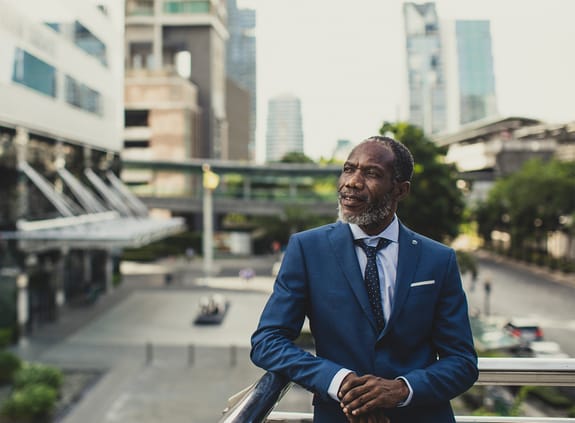 Businessman standing on a balcony