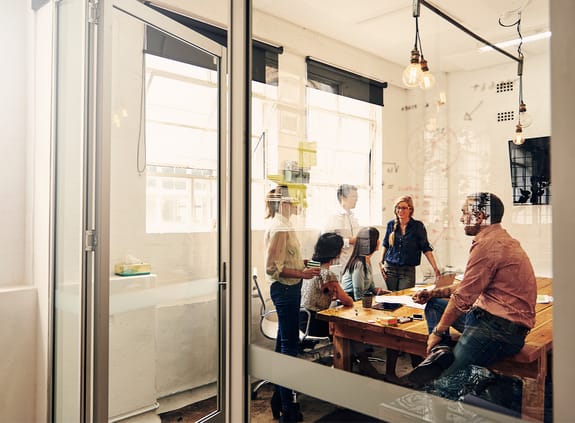 Coworkers having a meeting together in an office