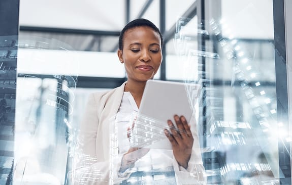 businesswoman using a digital tablet in a boardroom