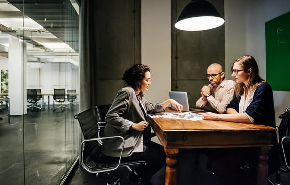 Business meeting betweeen three people