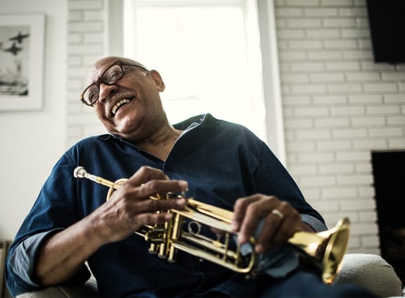 Portrait of senior man with trumpet