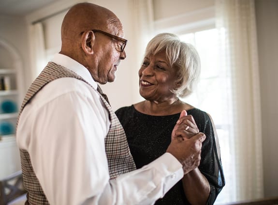 Retiree woman and man laughing