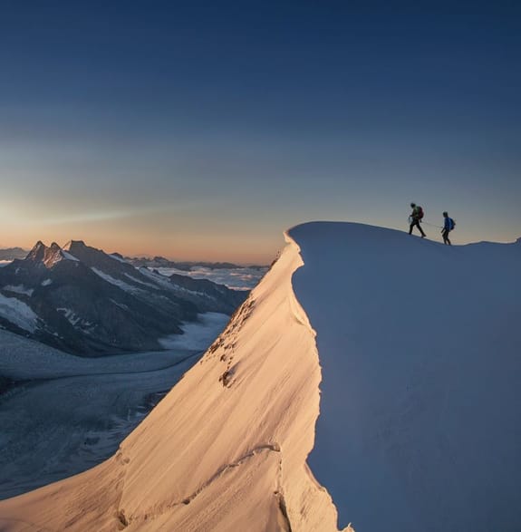 Hikers on the Jungfrau Summit in Switzerland