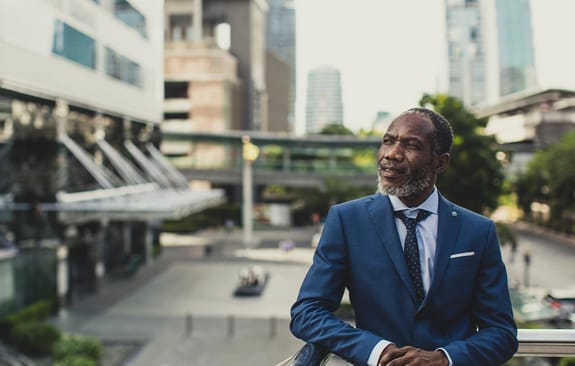 Businessman standing on a balcony